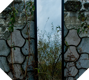 reflection acting as a doorway through rock wall